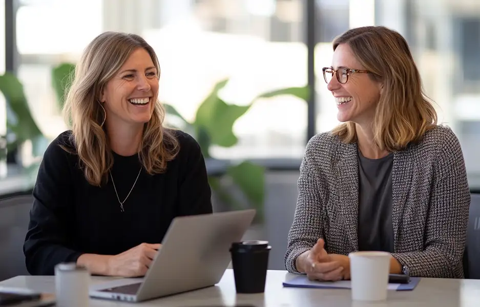 two people chatting in an office